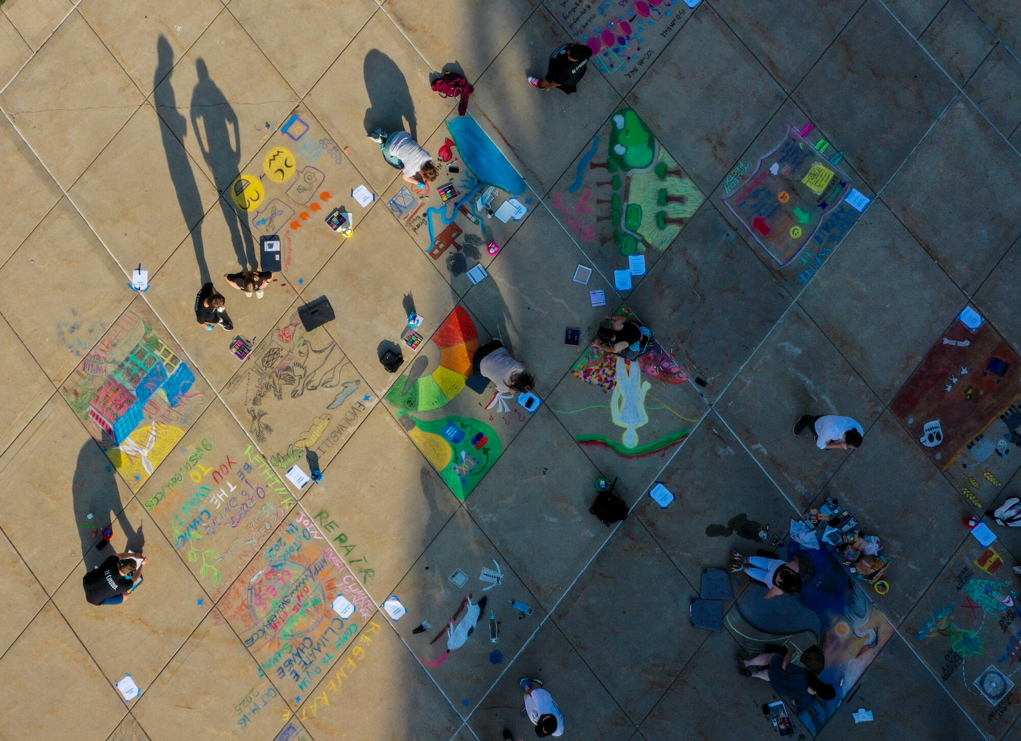 Students take part in the Chalk Art Symposium at the Mary Idema Pew Library plaza on September 18.